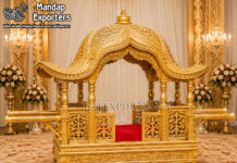 Traditional Indian Bridal Entry Doli for Grand Weddings Traditional Indian bridal entry doli with royal golden carved dome, decorative pillars, jali panels and cushioned seating for grand Indian weddings and luxury bridal entry ceremonies.