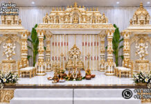 Majestic Elephant Pillar Kalyana Mandapam For South Indian Weddings Majestic Elephant Pillar Kalyana Mandapam For South Indian Weddings: White-and-gold South Indian Kalyana Mandapam featuring elephant-base pillars, temple-style crowns and Ganesha statues.
