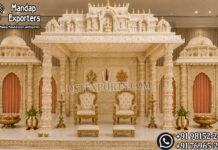 Premium Tirupati Theme Mandap for South Indian Weddings Premium Tirupati Theme Mandap for Grand South Indian Weddings Premium white and gold Tirupati temple theme wedding mandap with carved pillars, gopuram domes, Shankhu Chakra Namam backdrop and bride-groom chairs.