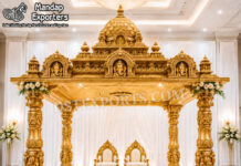 Traditional Ganesha Mandap for Destination Weddings Traditional Ganesha Mandap for Destination Weddings Traditional golden Ganesha temple-style wedding mandap with carved pillars, grand dome and bride-and-groom chairs.